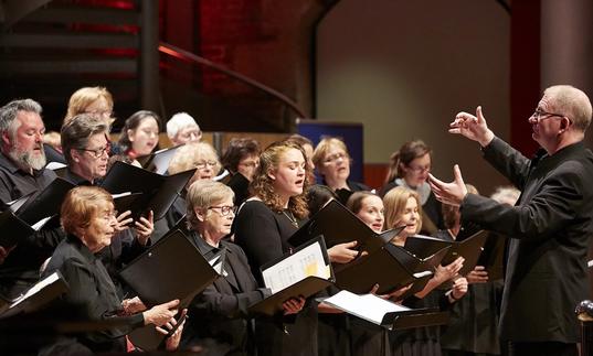 The LSO Community Choir performing with choral director