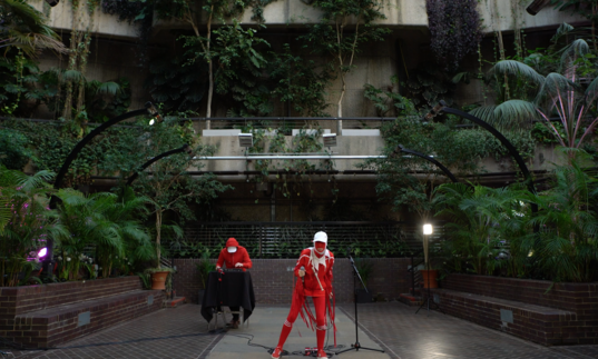 Two figures in costume in the Conservatory