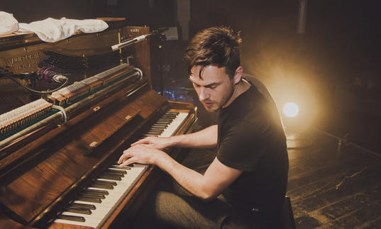 Pieter de Graaf playing a piano