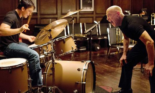 Shot of drummer and man yelling