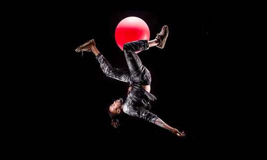 Man falling with balloon