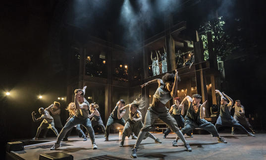 A group of dancers in an energetic pose