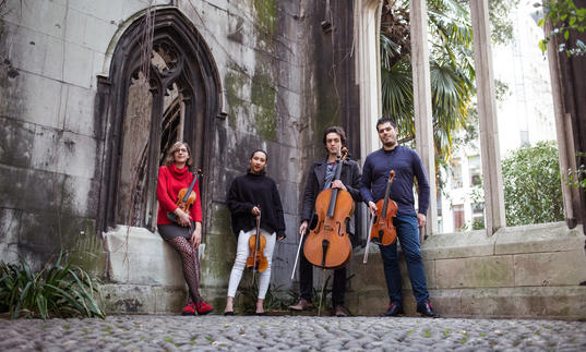 Portorius String Quartet pictured outside holding instruments