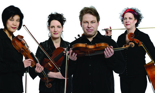 Quatuor Bozzini pictured holding instruments