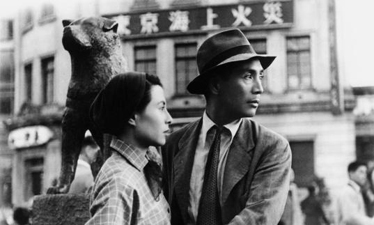 A black and white image of a man and a woman in Japan in the 1940s