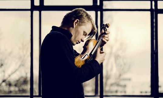 Pekka lost in the moment as he passionately plays his violin