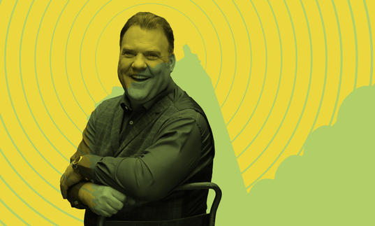 Bryn Terfel laughing in front of the Barbican tower