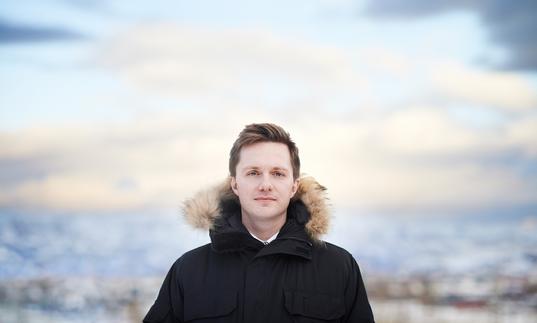 James McVinnie in front of a blurred out background