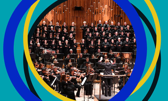 BBC Symphony Chorus on the Barbican stage, with BBC SO branding around the edges