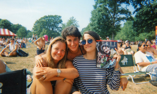 three woman take a photo together