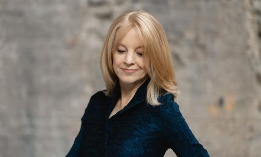 colour photo of Maria Schneider wearing a black jacket