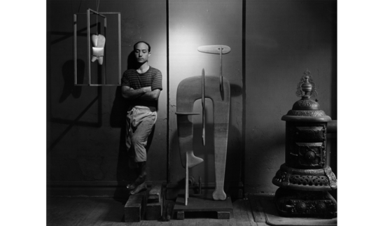 Isamu Noguchi in his studio