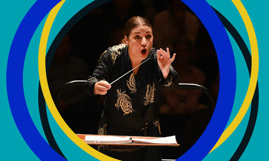 Dalia Stasevska looks to the camera in a conducting action shot. BBC SO branding frames the edge of the image.
