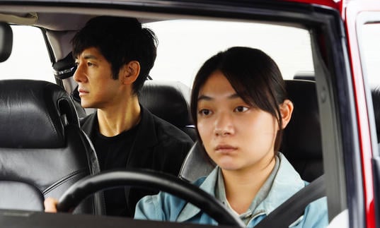 Car interior with lead actors Hidetoshi Nishijima and Toko Miura sitting inside