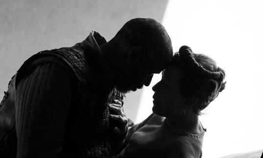 Depicted in black and white, Denzel Washington as Macbeth and Frances McDormand as Lady Macbeth