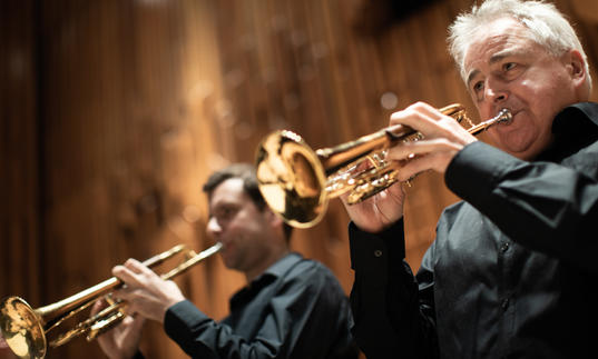 Trumpeters from Britten Sinfonia playing their instruments