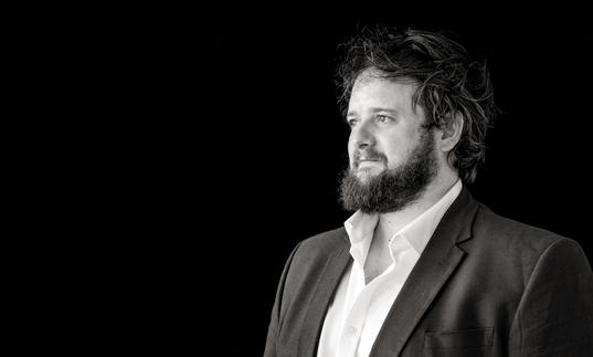 Black and white photo of Allan Clayton