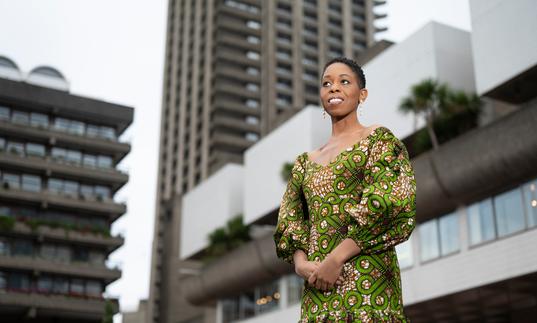 Samantha Ege standing on the Barbican's Lakeside Terrace