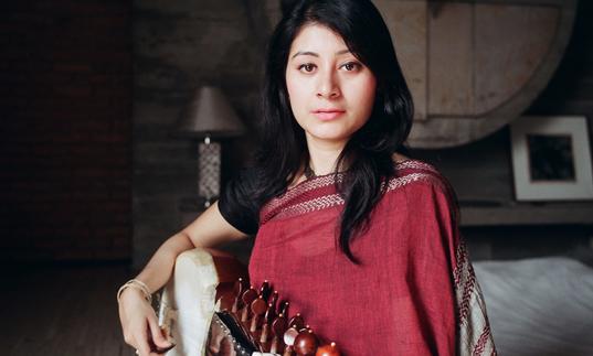 Rajrupa Chowdhury seated with her sarod