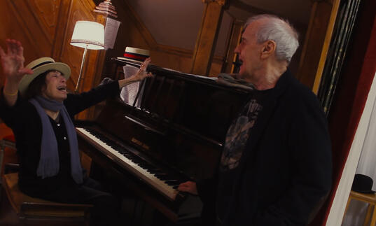 Barry & Joan by a piano
