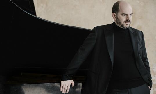 Kirill Gerstein next to piano