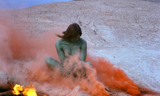 Judy Chicago, Immolation from Women and Smoke, 1972 Fireworks performance Performed by Faith Wilding in the California Desert © Judy Chicago/Artists Rights Society (ARS), New York Photo courtesy of Through the Flower Archives Courtesy of the artist; Salon 94, New York; and Jessica Silverman Gallery, San Francisco