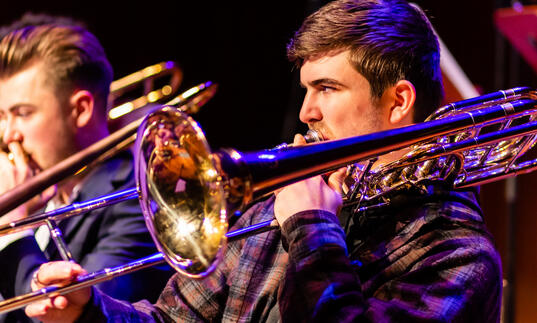 Two Guildhall School jazz trombone players in performance