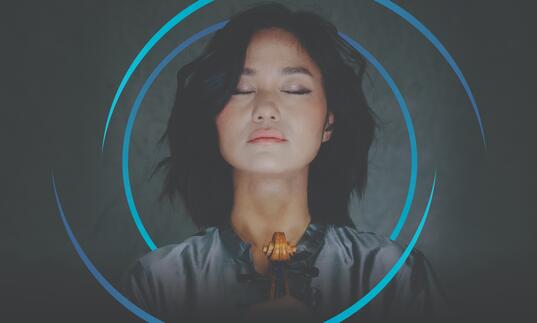 Sayaka Shoji with her eyes closed, and circular blue swirls framing her head