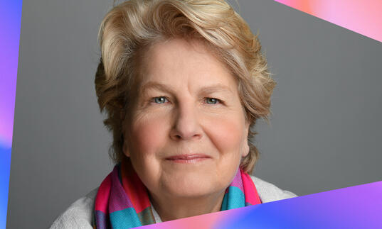 Sandi Toksvig with blue and pink colour blocks framing the photo