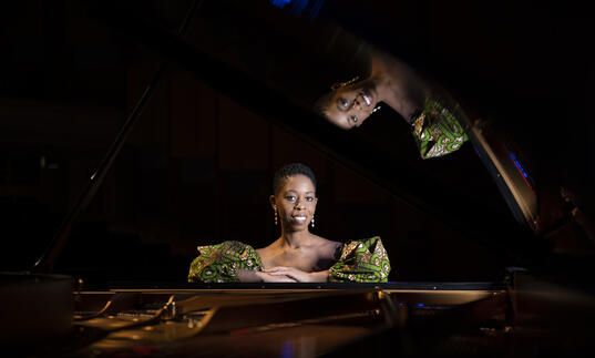 Samantha Ege sat in front of a grand piano