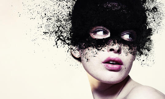 A person wearing a black mask