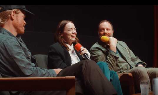 Jesse Plemmons, Emily Stone and Yorgos Lanthimos laugh on stage during a screentalk. 