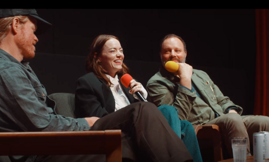 Jesse Plemmons, Emily Stone and Yorgos Lanthimos laugh on stage during a screentalk.