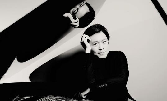 Sunwook Kim sitting at a grand piano