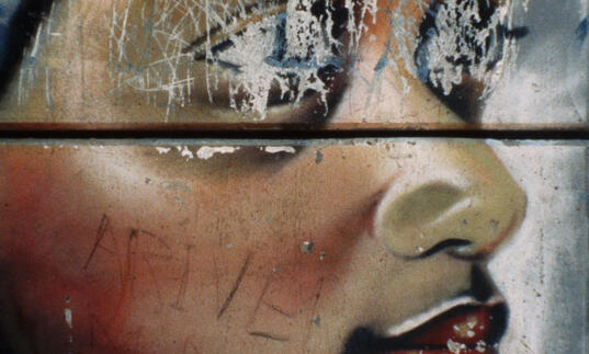 A drawing of a Black child with scratched out eyes