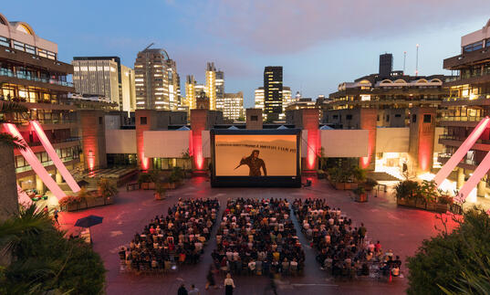 A shot of a large outdoor cinema screen in our Sculpture Court. 