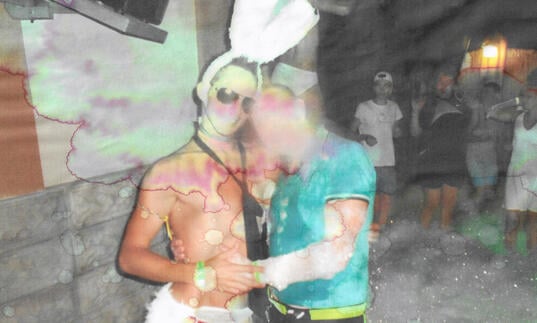 Simeiz image of men in bunny ears with blurred faces 