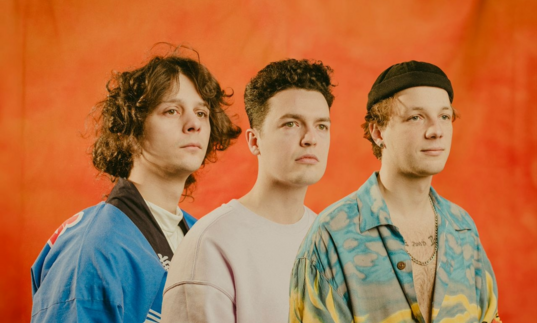 An image of the band Immortal Onion in front of an orange background