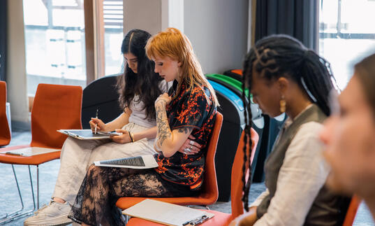 A group of young people at a writing workshop