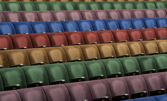 Photo of multicoloured seats in the Barbican Hall