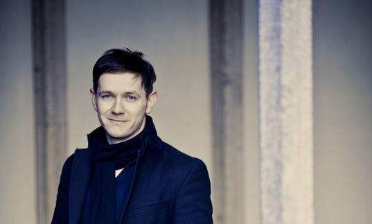 A full colour photograph of Iestyn Davies