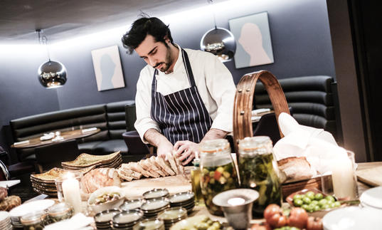 A photo of a chef in Barbican's restaurant, Osteria