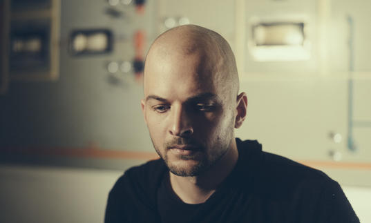 Nils Frahm gazing downwards