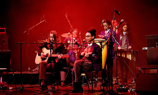 Photo of young people performing music