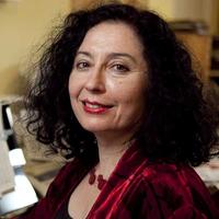 Photo of Elena Kats-Chernin smiling at the camera