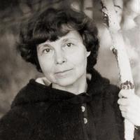 Black and white photo of Sofia Gubaidulina looking at the camera