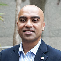 A headshot of Munsur Ali