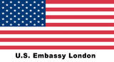 A logo of the American flag with the word 'US Embassy London' written on it.